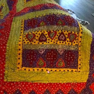 This is a beautiful hand crafted hand stitched quilt. It very weighted.